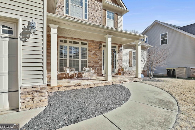 property entrance with covered porch