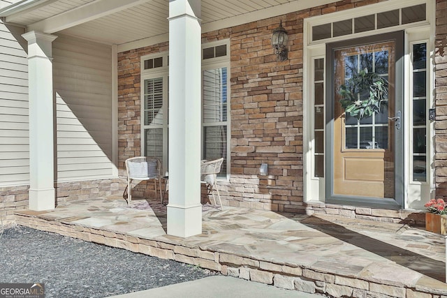 entrance to property featuring covered porch