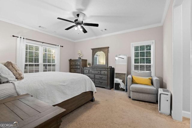 bedroom with ceiling fan, ornamental molding, and light carpet