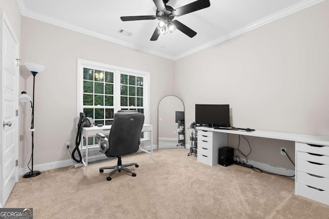 carpeted office space featuring ceiling fan and crown molding