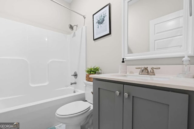 full bathroom with vanity, bathtub / shower combination, and toilet