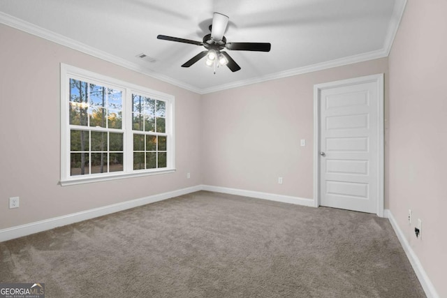 spare room with carpet floors, ceiling fan, and ornamental molding