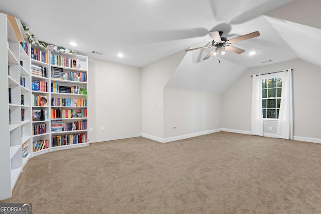 additional living space with carpet flooring, ceiling fan, and lofted ceiling