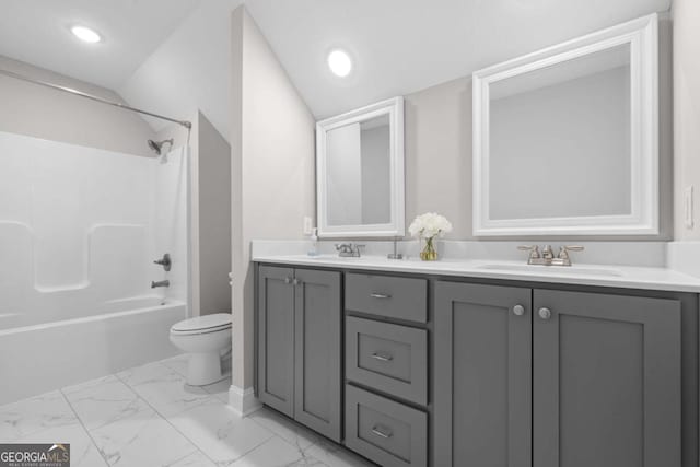 full bathroom featuring shower / washtub combination, vanity, vaulted ceiling, and toilet