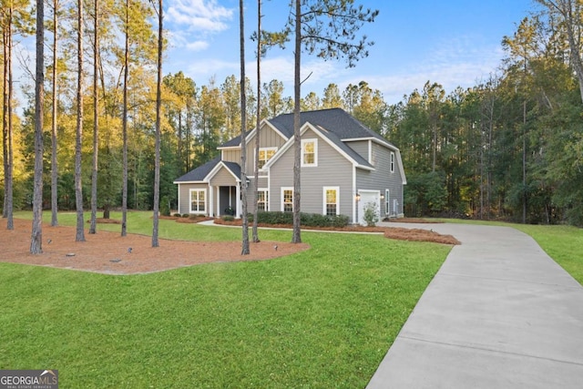 view of front facade with a front yard and a garage