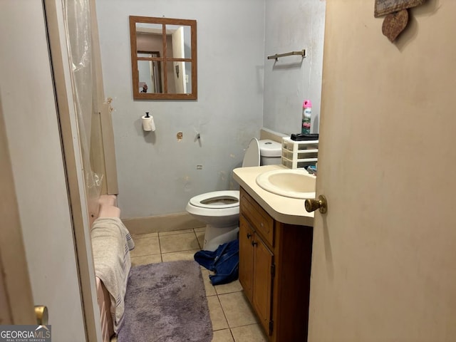 bathroom featuring tile patterned flooring, vanity, and toilet