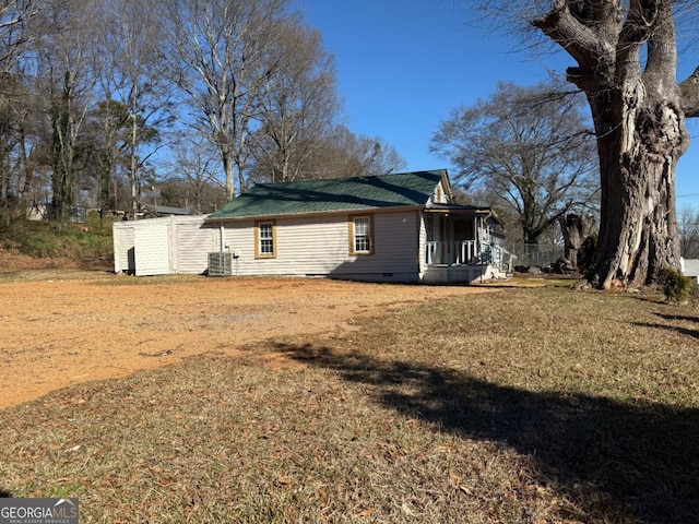 view of property exterior featuring a lawn