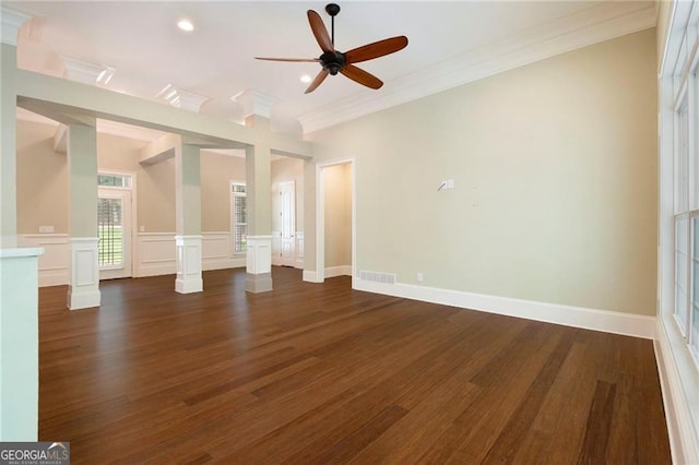 interior space with dark hardwood / wood-style flooring, ceiling fan, and ornamental molding