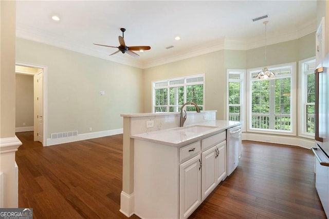 kitchen featuring a kitchen island with sink, ceiling fan, sink, decorative light fixtures, and white cabinets