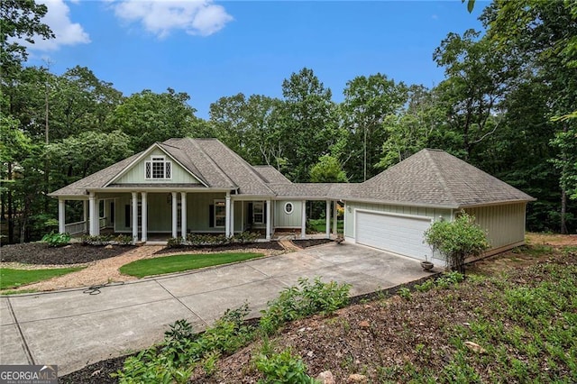 view of front of home with covered porch and a garage