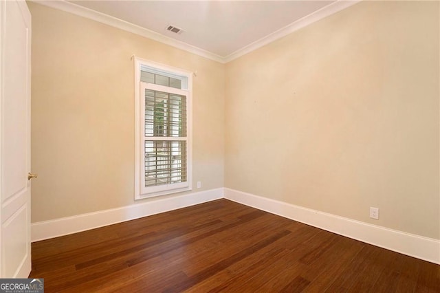 unfurnished room featuring hardwood / wood-style flooring and ornamental molding