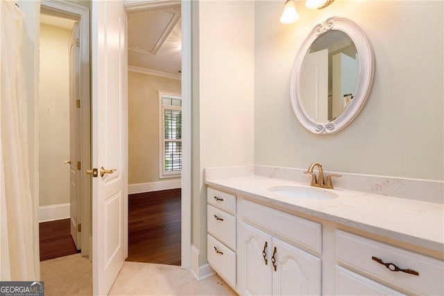 bathroom with vanity and ornamental molding