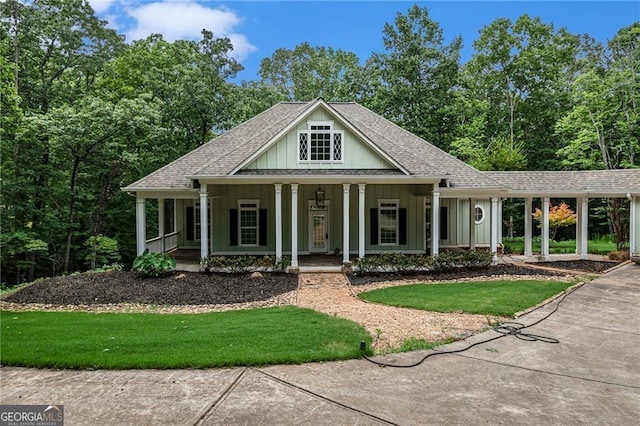 view of front of property with a carport and covered porch