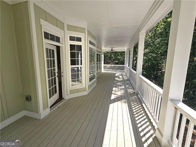 wooden deck with ceiling fan