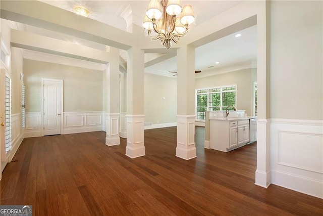 unfurnished room with dark hardwood / wood-style flooring, sink, and ceiling fan with notable chandelier