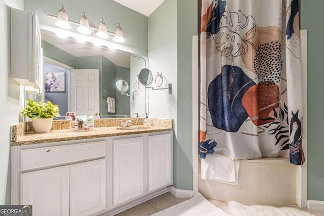 bathroom featuring vanity, tile patterned floors, and curtained shower