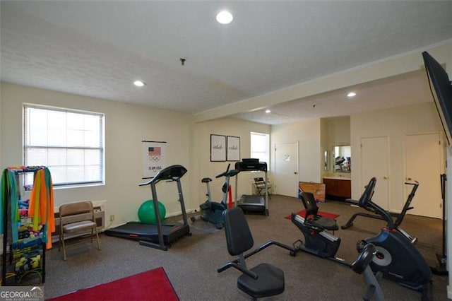 exercise area featuring a textured ceiling