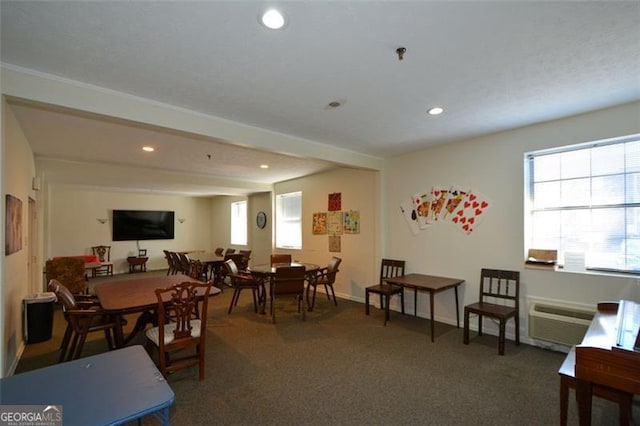 carpeted dining space with an AC wall unit