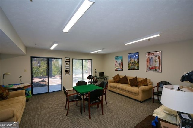 recreation room with carpet flooring