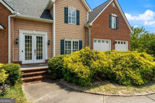 view of front of house featuring french doors and a garage