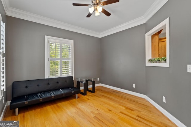 sitting room featuring crown molding, ceiling fan, and light hardwood / wood-style floors