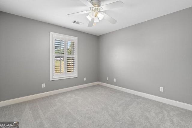 empty room with carpet and ceiling fan