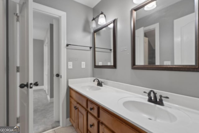 bathroom with tile patterned flooring and vanity