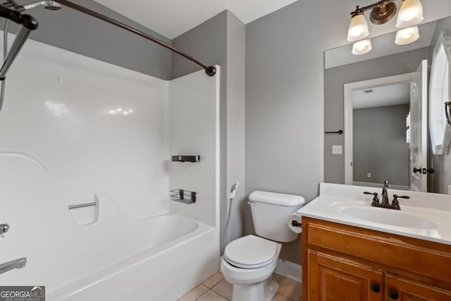 full bathroom with toilet, bathtub / shower combination, vanity, and tile patterned floors