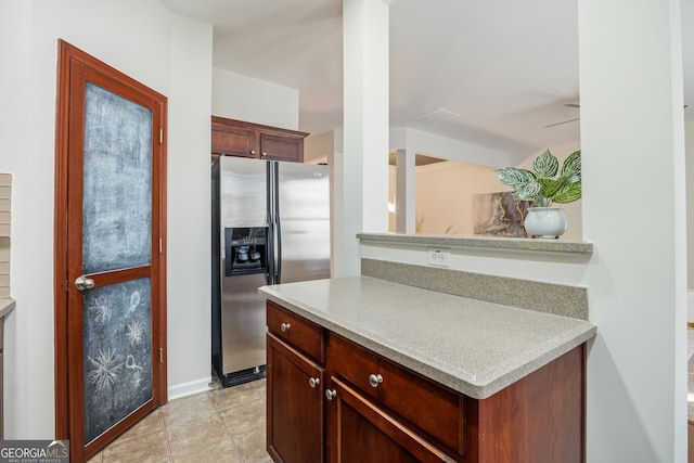 kitchen with stainless steel fridge with ice dispenser and ceiling fan