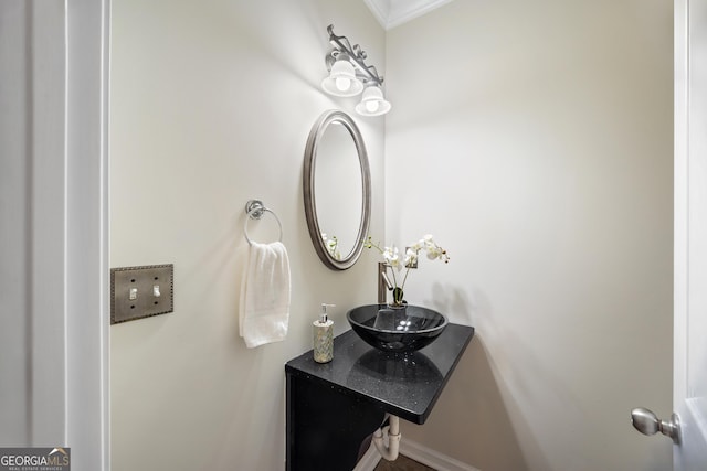 bathroom with vanity and crown molding