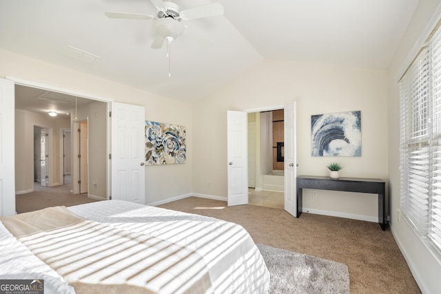 bedroom with light colored carpet, vaulted ceiling, and ceiling fan