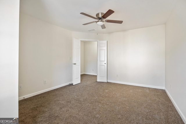 carpeted empty room with ceiling fan