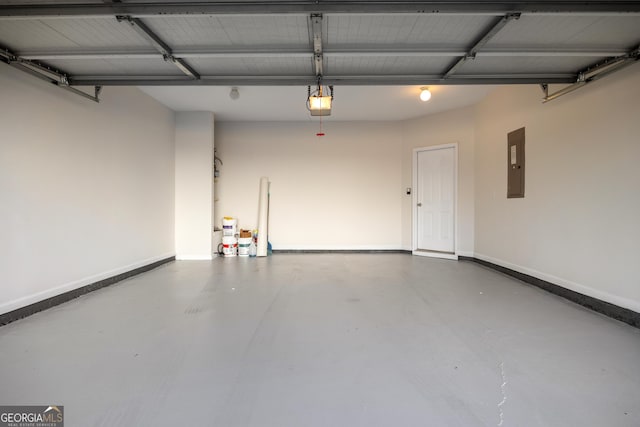 garage with a garage door opener and electric panel