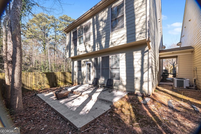 rear view of property with a patio and central AC unit