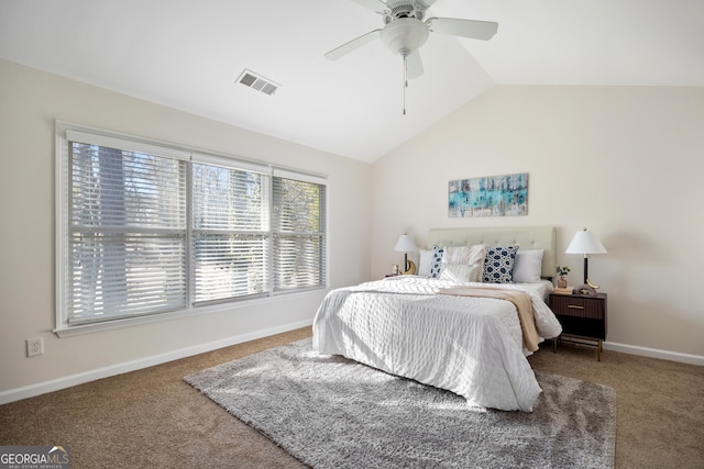 bedroom with ceiling fan, carpet floors, and lofted ceiling