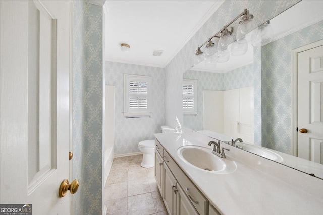 bathroom featuring tile patterned flooring, vanity, toilet, and crown molding