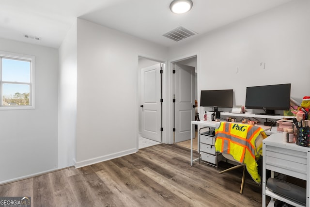 office space with hardwood / wood-style floors