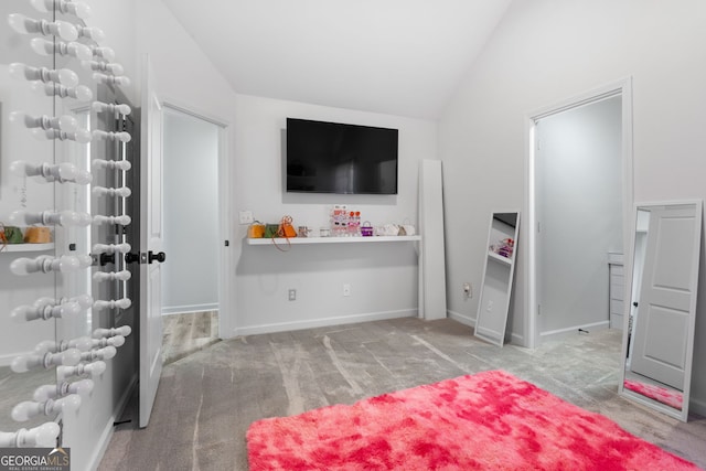 interior space featuring light colored carpet and vaulted ceiling