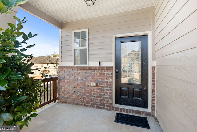 doorway to property featuring covered porch