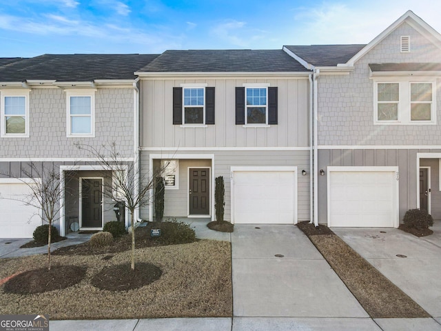 townhome / multi-family property featuring a garage