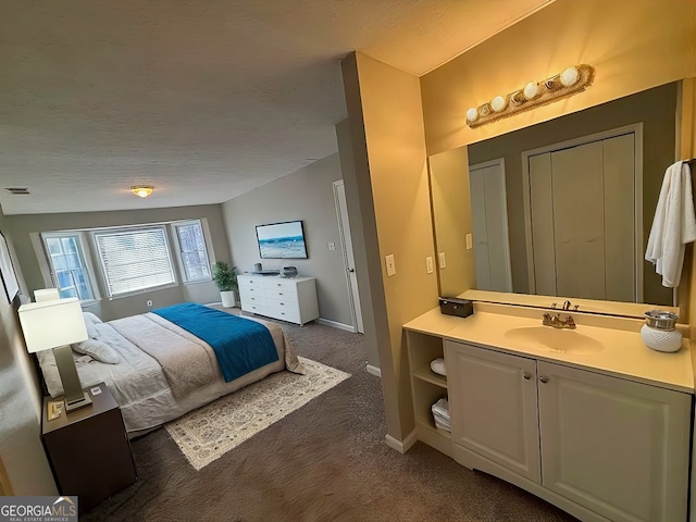 carpeted bedroom with sink