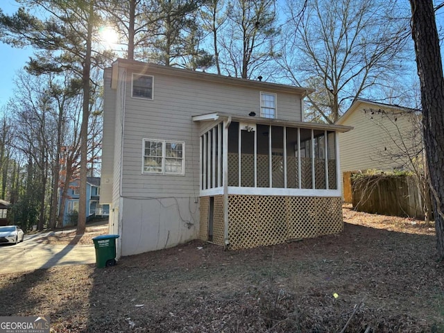 back of property featuring a sunroom