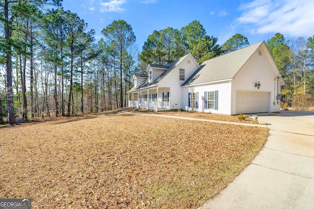 view of front facade featuring covered porch and a garage