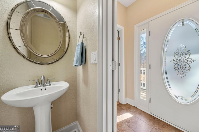 bathroom with tile patterned flooring and sink