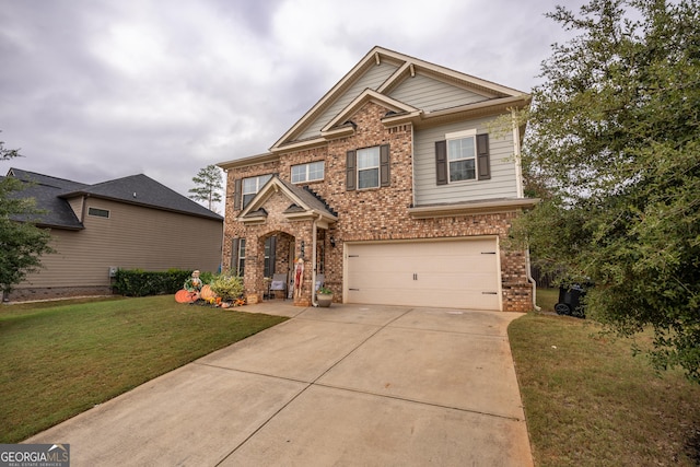 view of front of home with a garage and a front yard