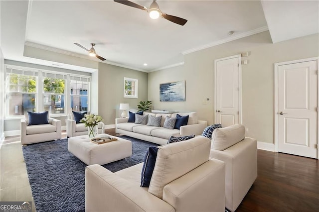 living room featuring dark hardwood / wood-style floors and ornamental molding