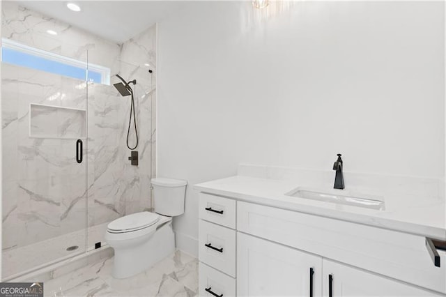 bathroom with walk in shower, vanity, and toilet