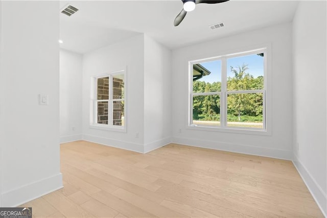 spare room with light hardwood / wood-style floors and ceiling fan