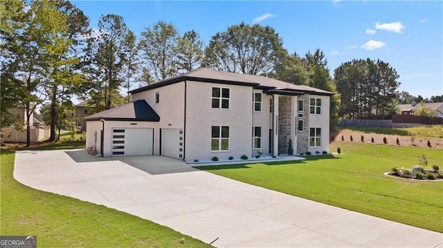 view of front of home with a garage and a front yard