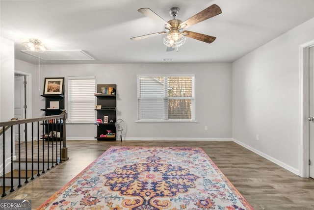 interior space featuring ceiling fan and dark hardwood / wood-style floors